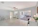 Sun-lit living room with an open floorplan and access to the kitchen and outdoor patio at 3127 Dawson St, Sarasota, FL 34239
