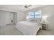 Bright main bedroom with soft lighting, closet and mirror access, and comfortable bed at 3127 Dawson St, Sarasota, FL 34239