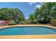 Beautiful pool surrounded by manicured landscaping creating a backyard oasis at 3127 Dawson St, Sarasota, FL 34239