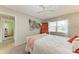 Comfortable bedroom features a large window, nautical decorations, and neutral color scheme at 3213 Mercer Rd, Bradenton, FL 34207