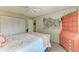Bright bedroom with closet, comfortable bed, and nautical decorations at 3213 Mercer Rd, Bradenton, FL 34207