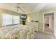 Light and airy bedroom with a large window, a TV, and white bedroom furniture at 3213 Mercer Rd, Bradenton, FL 34207