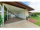 Spacious carport with a fan and adjacent storage shed at 3213 Mercer Rd, Bradenton, FL 34207