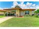 Inviting single-story home featuring a lush green lawn and terracotta tiled roof at 3213 Mercer Rd, Bradenton, FL 34207
