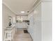 Bright kitchen with white cabinets, updated countertops, and stainless steel appliances at 3213 Mercer Rd, Bradenton, FL 34207