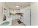 Bright kitchen with white cabinets, updated countertops, and stainless steel appliances at 3213 Mercer Rd, Bradenton, FL 34207