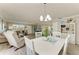 Open-concept living and dining area with comfortable seating and a view to the kitchen at 3213 Mercer Rd, Bradenton, FL 34207