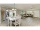 Open concept living and dining areas with sliding glass doors to the outside at 3213 Mercer Rd, Bradenton, FL 34207