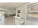 Open-concept living and kitchen area with a breakfast bar, seating, and access to the outside at 3213 Mercer Rd, Bradenton, FL 34207