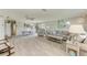 Open-concept living space with modern flooring and neutral decor at 3213 Mercer Rd, Bradenton, FL 34207