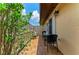 Outdoor patio featuring beautiful tile flooring, comfortable seating, and manicured foliage at 3213 Mercer Rd, Bradenton, FL 34207