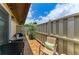 Cozy outdoor patio featuring comfortable seating, a table, and privacy fencing at 3213 Mercer Rd, Bradenton, FL 34207