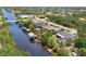 Aerial view of home on the canal, highlighting waterfront access and backyard features at 3500 Liberty St, Port Charlotte, FL 33948