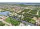 Expansive aerial view of canal-front home, showcasing waterfront access and lush surroundings at 3500 Liberty St, Port Charlotte, FL 33948