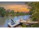 Relaxing view from the home's private dock, highlighting waterfront tranquility and mature landscape at 3500 Liberty St, Port Charlotte, FL 33948