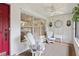 Inviting front porch with seating and a decorative clock, perfect for enjoying quiet moments at 3500 Liberty St, Port Charlotte, FL 33948