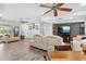Cozy living room with lots of natural light flowing to an adjacent dining area at 3500 Liberty St, Port Charlotte, FL 33948