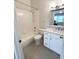 Bathroom features white cabinets, a tub and a shower at 396 Countryside Key Blvd, Oldsmar, FL 34677