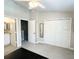 A light and airy bedroom featuring double closets and neutral walls at 396 Countryside Key Blvd, Oldsmar, FL 34677