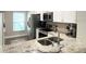 Modern kitchen featuring white cabinets, stainless steel appliances, and a view of the window at 396 Countryside Key Blvd, Oldsmar, FL 34677