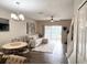 Bright living room featuring modern decor, comfortable seating, and sliding doors to the outside at 396 Countryside Key Blvd, Oldsmar, FL 34677