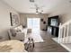 Cozy living room featuring a large television, comfortable seating, and ample natural light at 396 Countryside Key Blvd, Oldsmar, FL 34677