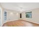 Bedroom featuring light walls, wood floors, and natural lighting at 408 Fletcher St, Port Charlotte, FL 33954