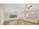 Expansive living room with ceiling fans and natural light, ideal for entertaining or relaxing at 408 Fletcher St, Port Charlotte, FL 33954
