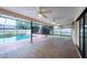 Outdoor patio with a screened-in enclosure and access to a private pool at 408 Fletcher St, Port Charlotte, FL 33954