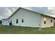 Rear of the home featuring a garage and access to the backyard at 4353 Hidden River Rd, Sarasota, FL 34240