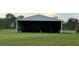 Spacious barn with ample storage and workspace potential at 4353 Hidden River Rd, Sarasota, FL 34240