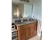 Bathroom vanity featuring a granite countertop, under-mount sink, and ample storage at 4353 Hidden River Rd, Sarasota, FL 34240