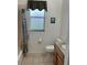 Cozy bathroom with a shower-tub combo, modern toilet, and granite countertop sink at 4353 Hidden River Rd, Sarasota, FL 34240