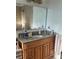 Bathroom with granite countertop vanity and a large mirror above at 4353 Hidden River Rd, Sarasota, FL 34240