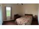 Bedroom features a comfortable bed, soft natural light, and ample space at 4353 Hidden River Rd, Sarasota, FL 34240
