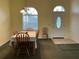 Dining room boasts natural light, seating for six, and a welcoming atmosphere at 4353 Hidden River Rd, Sarasota, FL 34240