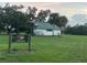 Exterior view with community signage and well-maintained lawn at 4353 Hidden River Rd, Sarasota, FL 34240