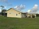 Single-story home with a metal roof, screened-in lanai and spacious backyard at 4353 Hidden River Rd, Sarasota, FL 34240