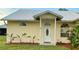 Inviting front entrance featuring a decorative glass door and well-maintained landscaping at 4353 Hidden River Rd, Sarasota, FL 34240