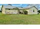 Charming single-story home with manicured lawn and lush landscaping around the front entrance at 4353 Hidden River Rd, Sarasota, FL 34240