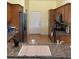 Well-equipped kitchen with granite countertops, wood cabinetry, and stainless steel appliances at 4353 Hidden River Rd, Sarasota, FL 34240