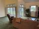Bright living room with vaulted ceilings, sliding glass doors, and outdoor access at 4353 Hidden River Rd, Sarasota, FL 34240