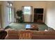 Comfortable living room featuring neutral tones, a large window, and a media center at 4353 Hidden River Rd, Sarasota, FL 34240