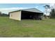Spacious metal outbuilding perfect for storage or workshop on a large lot at 4353 Hidden River Rd, Sarasota, FL 34240
