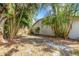 Fenced backyard features tropical landscaping offering a private outdoor space at 4473 Diamond S Cir, Sarasota, FL 34233