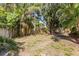 Well-defined backyard with lush tropical plants, offering a sense of privacy and natural beauty at 4473 Diamond S Cir, Sarasota, FL 34233