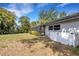 Fenced backyard featuring tropical landscaping, screen enclosed porch and room to roam at 4473 Diamond S Cir, Sarasota, FL 34233