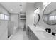 Modern bathroom featuring marble tiled wall, soaking tub, and double sink vanity at 4473 Diamond S Cir, Sarasota, FL 34233