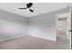 Light-filled bedroom features a modern ceiling fan, plush carpeting, and serene paint color at 4473 Diamond S Cir, Sarasota, FL 34233