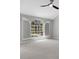 Light filled room showcasing arched window and shutter combination overlooking a pool at 4473 Diamond S Cir, Sarasota, FL 34233